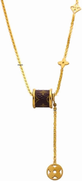 Gold Tone Black Cylinder Pendant and Star Charms